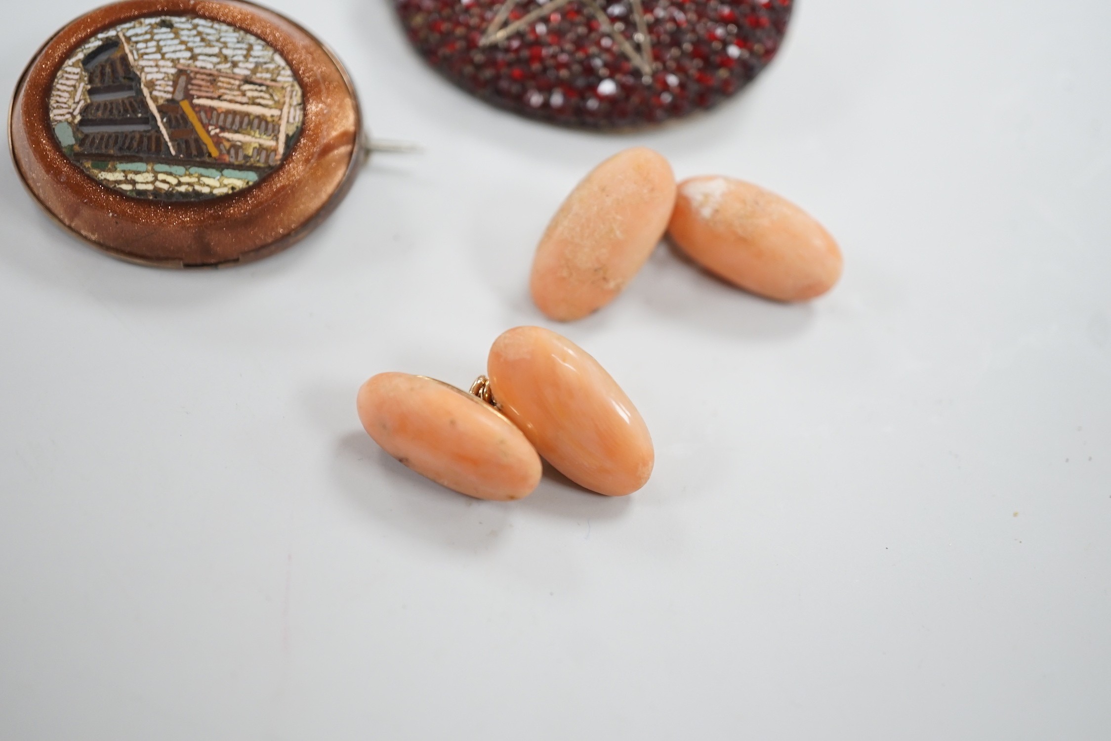 A pair of yellow metal and coral set cufflinks, coral 16mm and three assorted brooches including micro mosaic.